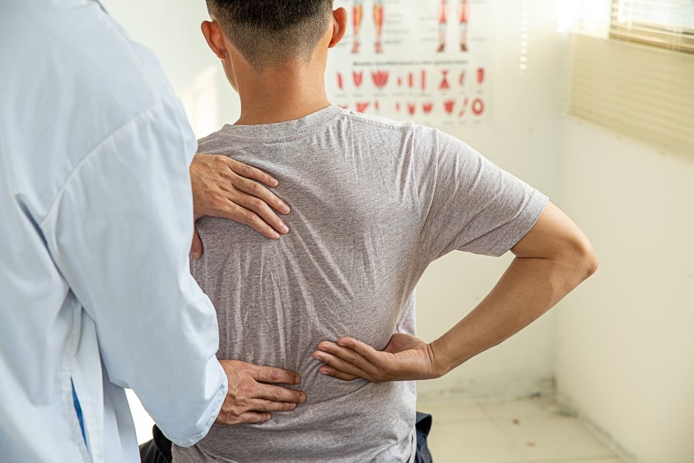 patient describing his lower back to his healthcare provider