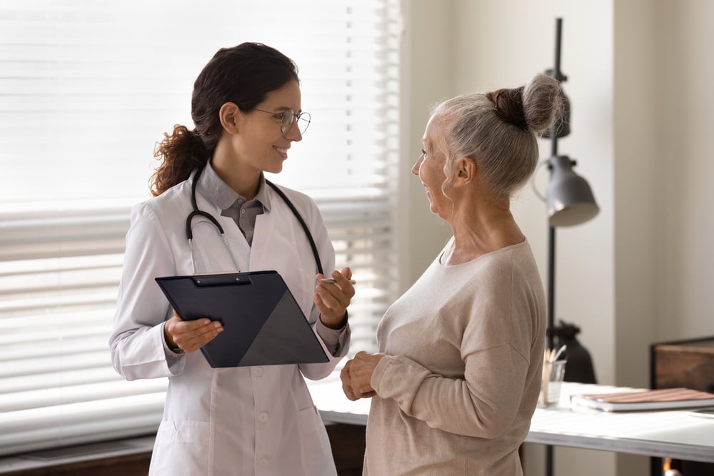 Healthcare professional discussing the importance of evidence-based care with her patient.