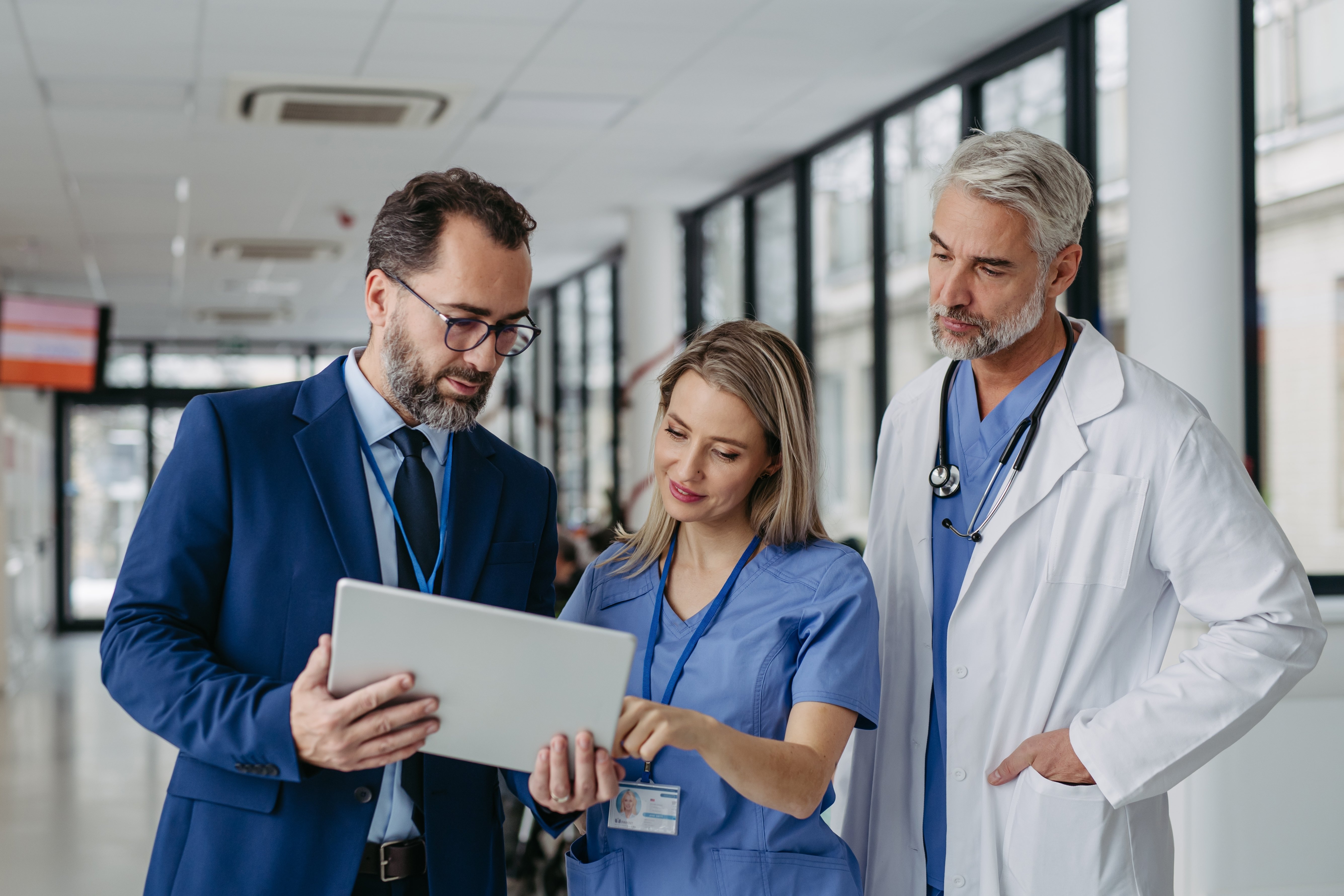 Healthcare professionals talking about the importance of patient reported outcomes (PROs).