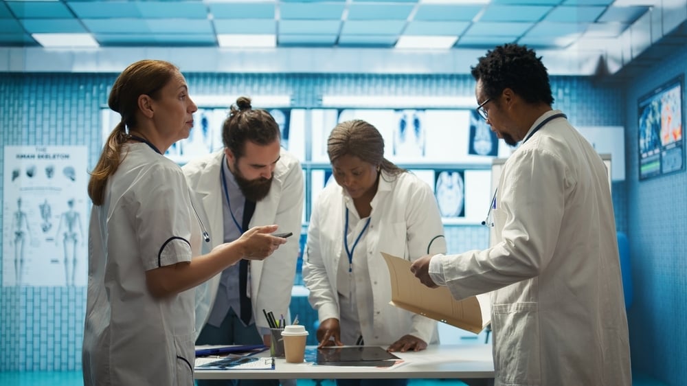 Healthcare team examines test results.